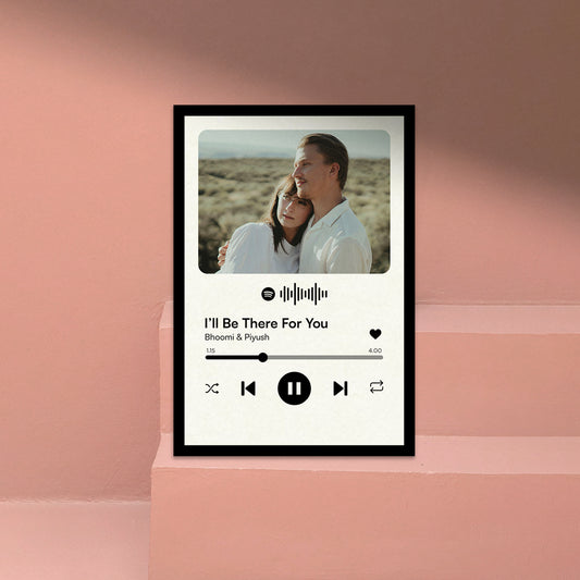 Personalized Music Photo Player Frame gift with Custom Song Name. Framed artwork with a couple and music player interface on a pink background.