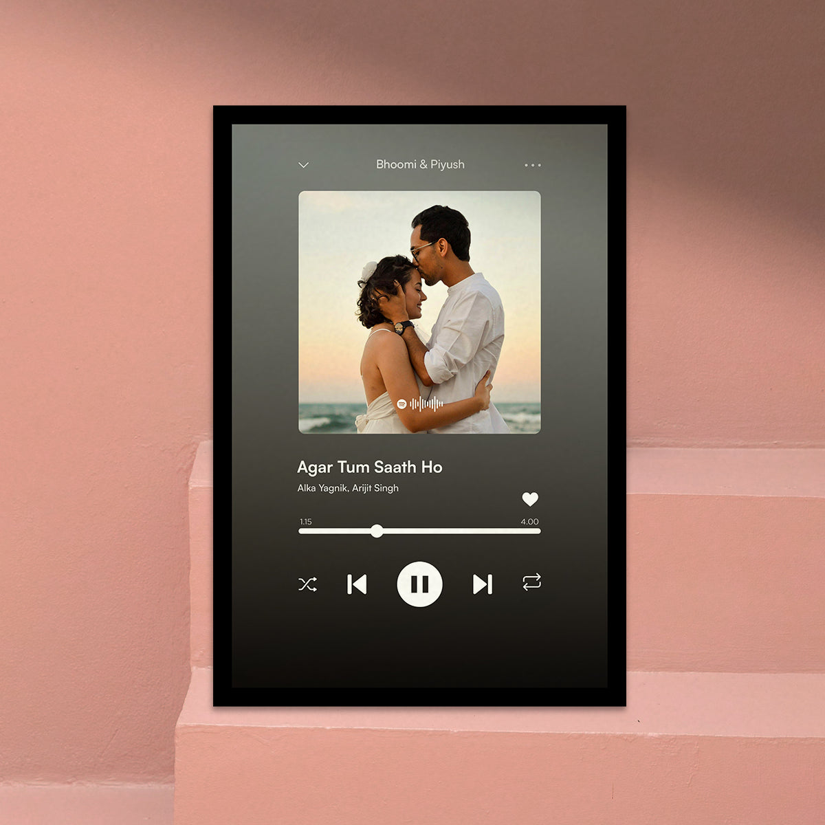 Personalized Spotify Music Player Photo Frame Custom Name. Framed digital music player interface with a couple on a pink background.