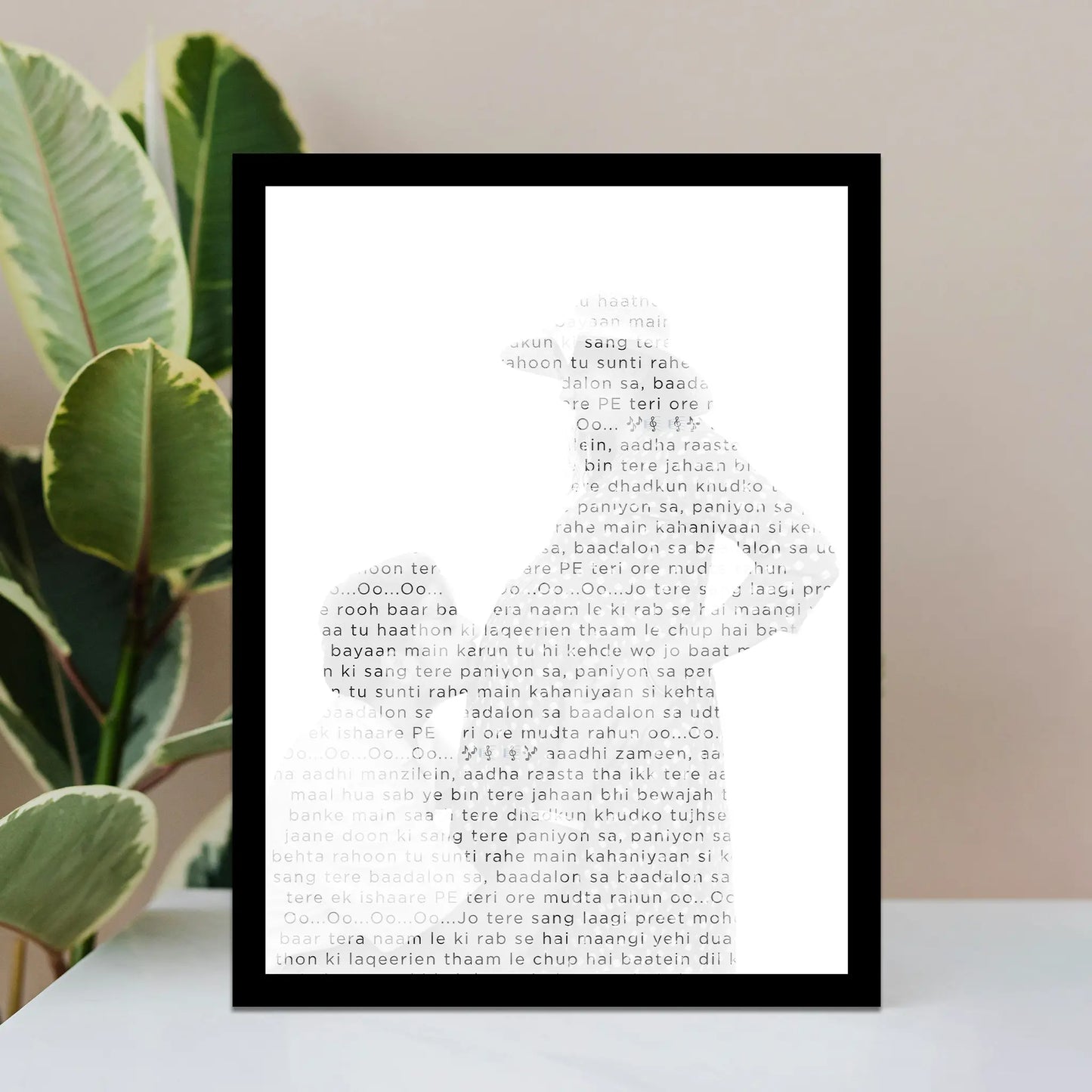 Framed Photo Lyrics wall art, Song lyrics on a white surface with green leaves in the background.