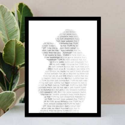 Framed Photo Lyrics wall art, Song lyrics on a white surface with green leaves in the background.